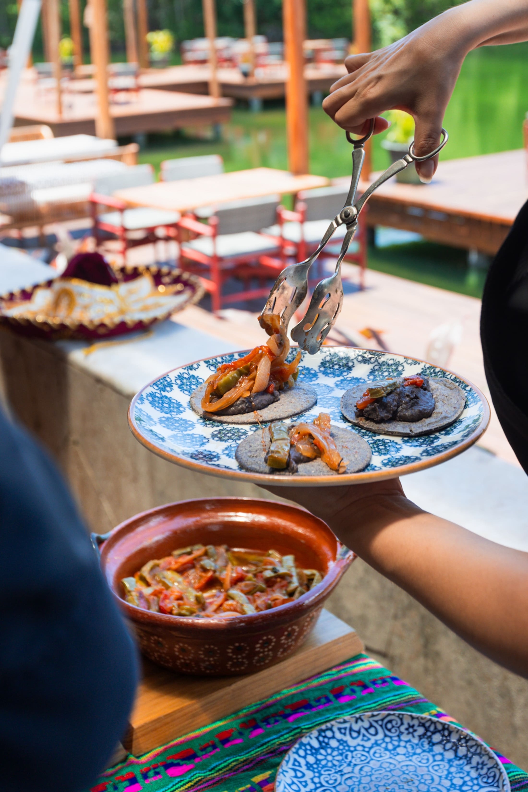 Tacos being prepared on a plate