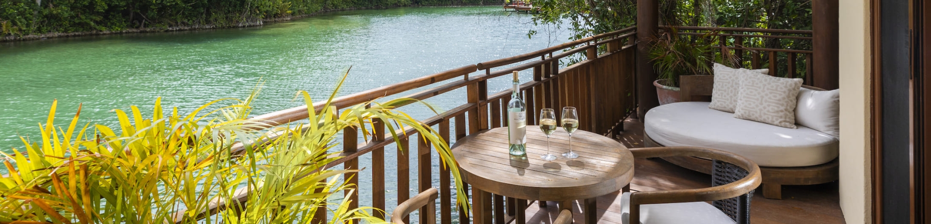 A guest room terrace with river views at Fairmont Mayakoba