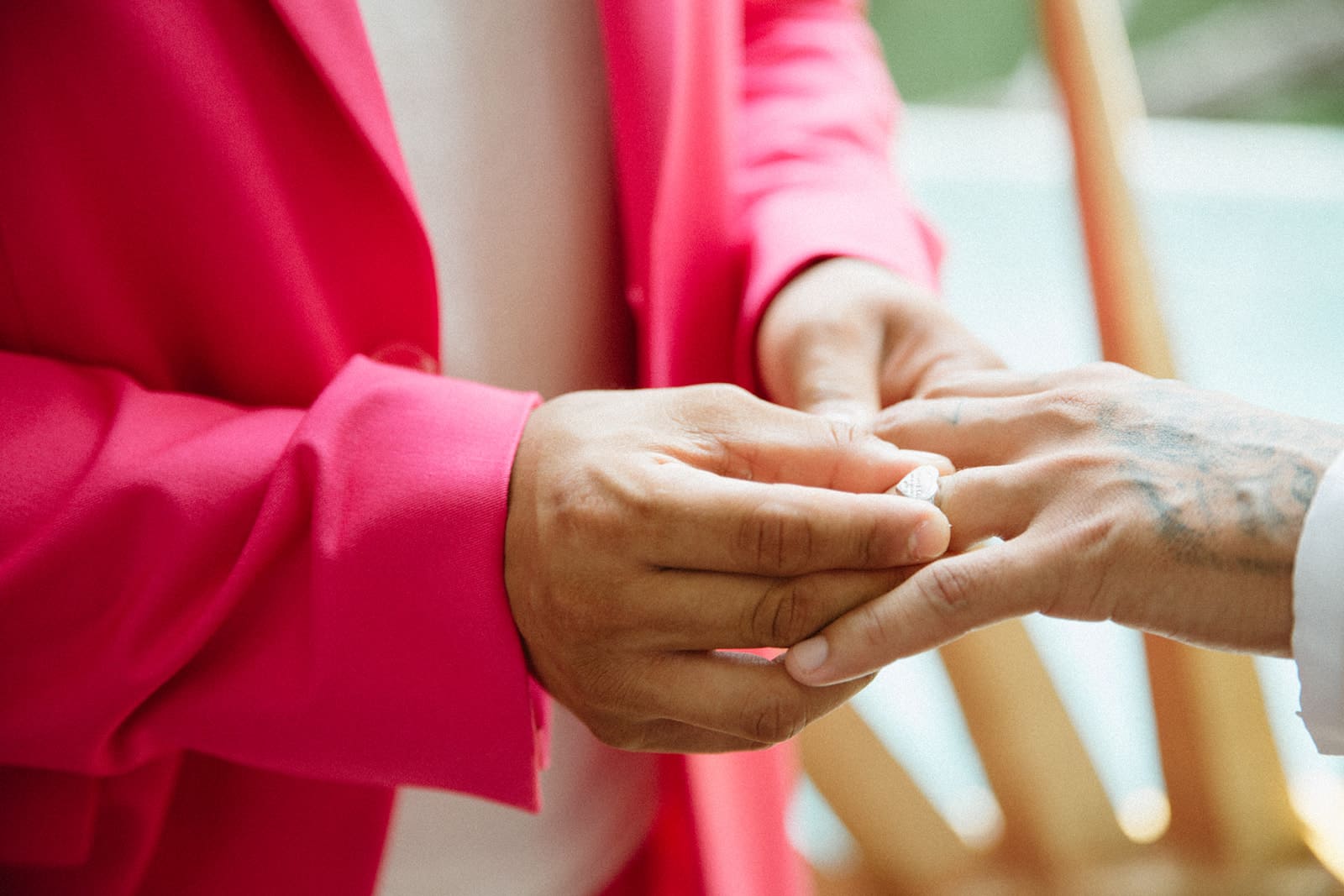 closeup of exchanging wedding rings